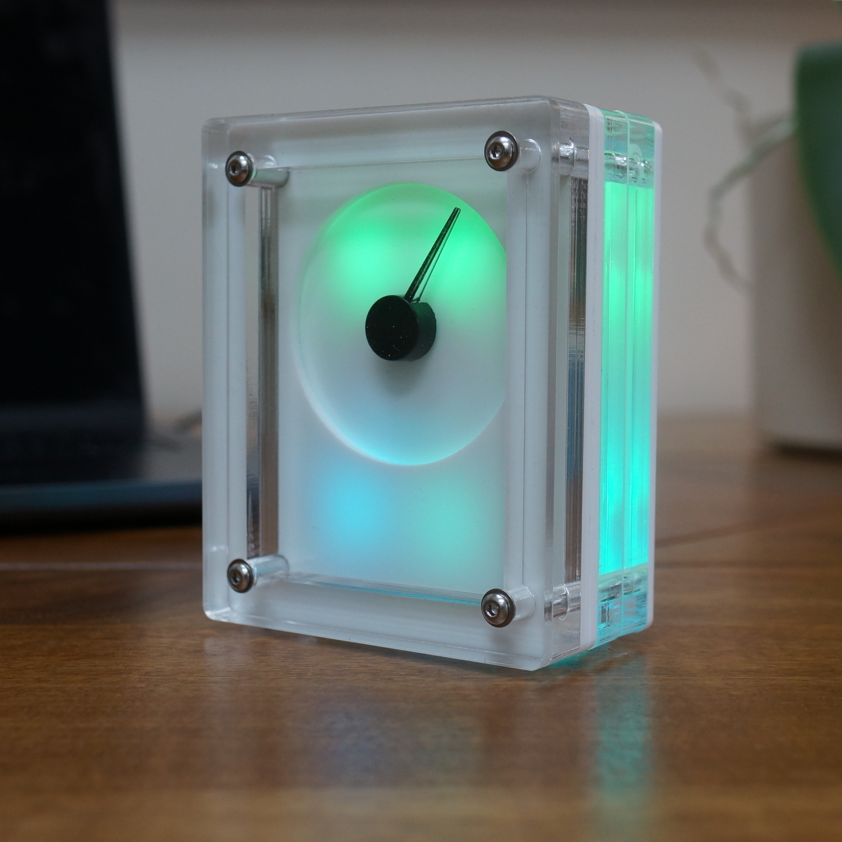 INDEX-01 calm technology object showing minimalist clock face, serene and focused workspace environment